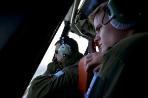 Handout photo of RAAF pilots looking from the cockpit of an RAAF AP-3C Orion aircraft during the search for MH370 in the southern Indian Ocean