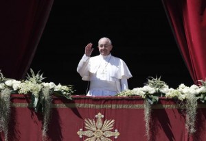 Pope Francis waves as he arrives to deliver the Urbi et Orbi (to the city and the world) benediction at the end of the Easter Mass in Saint Peter's Square at the Vatican