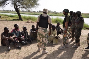 Troops interrogating some arrested terrorists