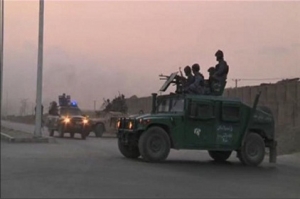 Video still shows Afghan security personnel on vehicles as an area near the Kabul airport comes under attack