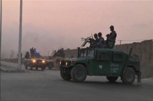 Video still shows Afghan security personnel on vehicles as an area near the Kabul airport comes under attack