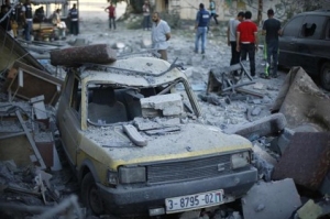 A car, which police said was damaged in an Israeli air strike that targeted the house of top Hamas political leader Mahmoud Zahar, is seen in Gaza City