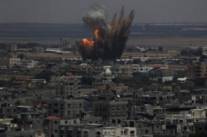 Smoke and flames are seen following what police said was an Israeli air strike in Rafah in Gaza Strip