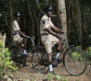 Actors Sadiq Daba and Aderupoko ride bicycles as they perform during filming for 'October 1', at a rural location in Ilaramokin village, southwest Nigeria