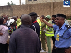 Police official addressing a voter. Security during elections