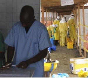 MSF health workers prepare at ELWA's hospital isolation camp during the visit of Senior U.N. System Coordinator for Ebola, Nabarro, in Monrovia