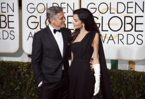 George and Amal Clooney arrive at the 72nd Golden Globe Awards in Beverly Hills