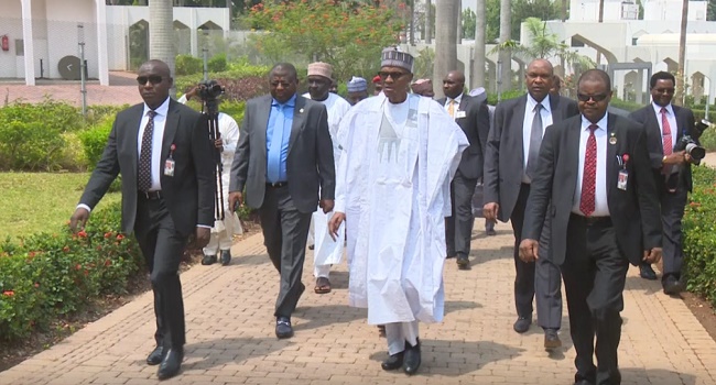 Buhari with his entourage 