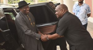 Jonathan and Wike sharing a handshake 