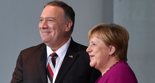 US Secretary of State Mike Pompeo (L) and German Chancellor Angela Merkel shake hands after making press statements prior to talks at the Chancellery in Berlin on November 8, 2019.