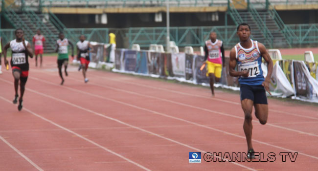 A sprinter dashes towards the finish line during the second edition of Channels Track and Field Classics