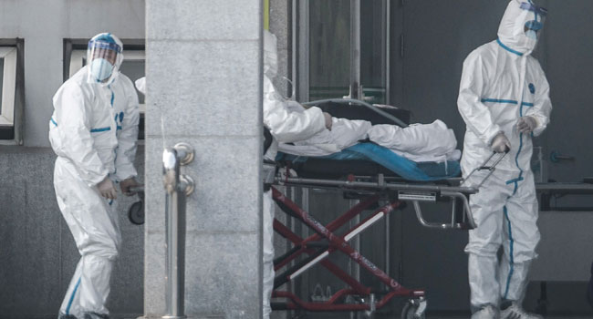 edical staff members carry a patient into the Jinyintan hospital, where patients infected by a mysterious SARS-like virus are being treated, in Wuhan in China's central Hubei province on January 18, 2020. STR / AFP