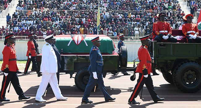 Military officers escort a gun carriage carrying the coffin of late former Kenya President, Daniel Arap Moi, draped in the Kenya national flag, during a state memorial service in Nairobi, on February 11, 2020. SIMON MAINA / AFP