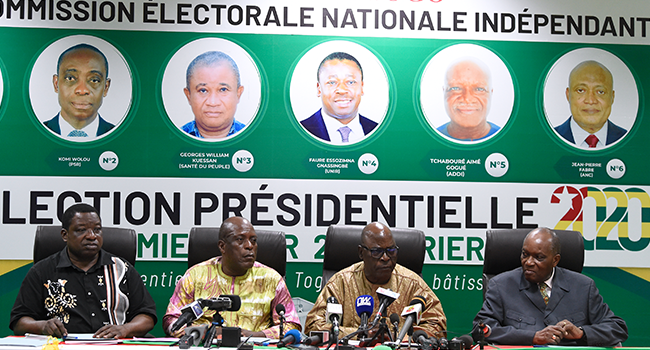 President of the Togolese Independent National Electoral Commission (CENI) Tchambakou Ayassor (2nd R), flanked by other members of the commission, announces the results of the presidential election at the CENI headquarters in Lome, February 24, 2020. PIUS UTOMI EKPEI / AFP