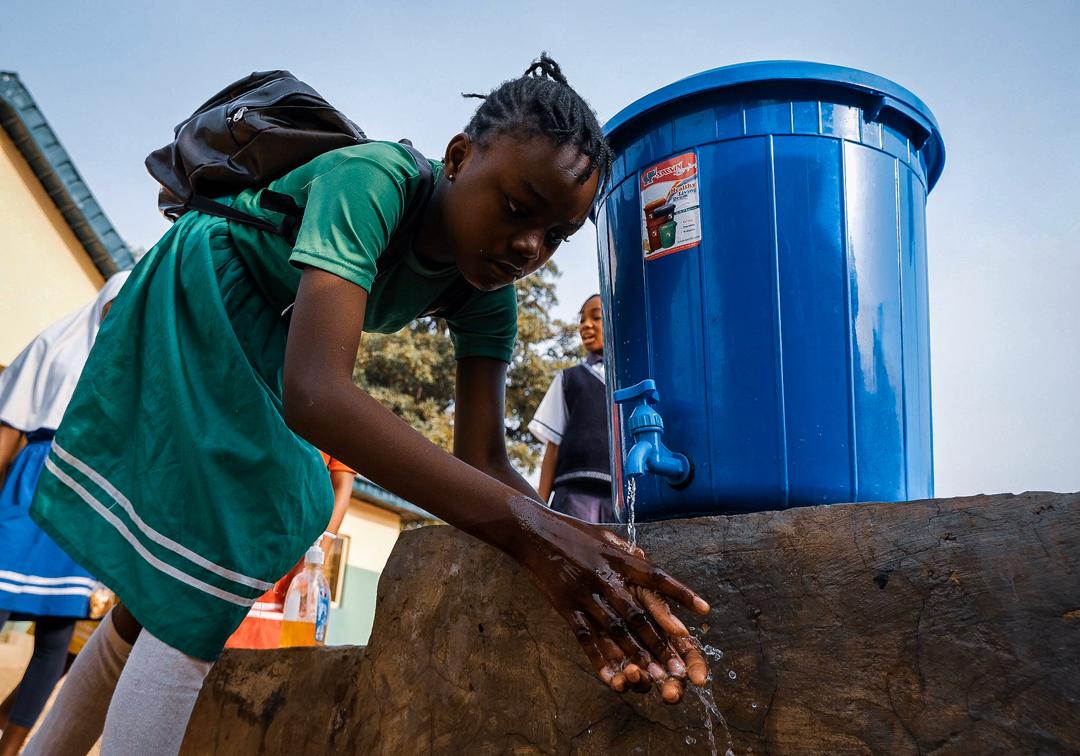 A schoolgirl washes her hand as one of the precautionary measure of preventing the spread of the Corona Virus at a Government Junior Secondary School in Abuja on Friday. March 20th 2020. Photo: Sodiq Adelakun / Channels TV