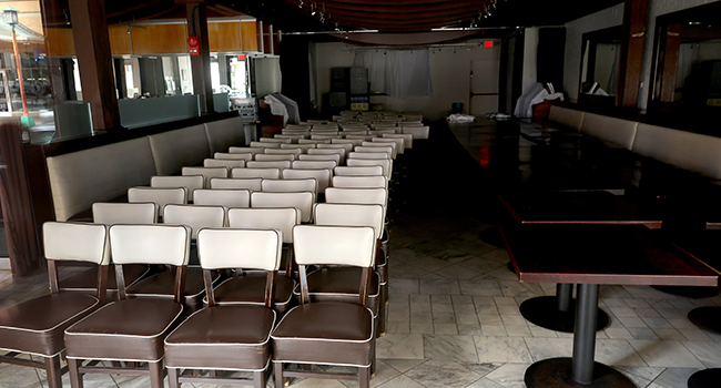 PHOTO USED TO ILLUSTRATE STORY: A restaurant's chairs and tables are stacked in the Chinatown neighborhood as people stay home and non-essential businesses are ordered closed due to the ongoing coronavirus pandemic March 27, 2020 in Washington, DC. Chip Somodevilla/Getty Images/AFP