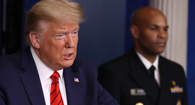 President Donald Trump speaks on the latest developments of the coronavirus outbreak, while flanked by U.S. Surgeon General Jerome Adams, in the James Brady Press Briefing Room at the White House March 19, 2020 in Washington, DC. Chip Somodevilla/Getty Images/AFP