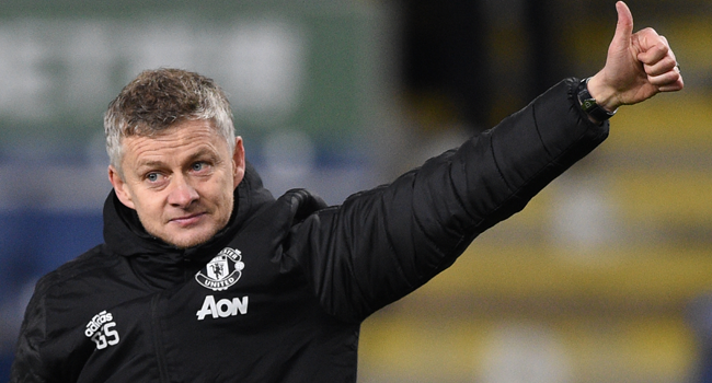 In this file photo taken on December 28, 2019 Manchester United's Norwegian manager Ole Gunnar Solskjaer salutes the travelling Manchester United fans at the end of the English Premier League football match between Burnley and Manchester United at Turf Moor in Burnley. Oli SCARFF / AFP