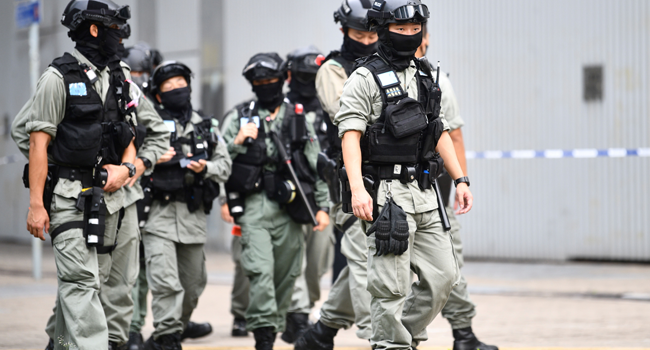 Riot police stand guard outside the Legislative Council in Hong Kong on May 27, 2020, ahead of a debate over a law that bans insulting China's national anthem, Anthony WALLACE / AFP
