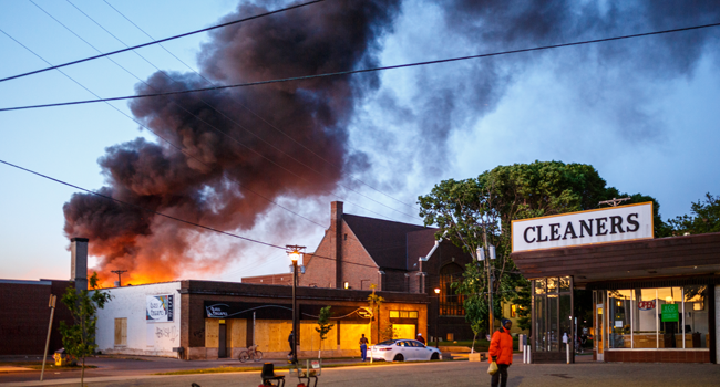 Flames rise from the cleaners shoop near the Third Police Precinct on May 28, 2020 in Minneapolis, Minnesota, during a protest over the death of George Floyd. Kerem Yucel / AFP