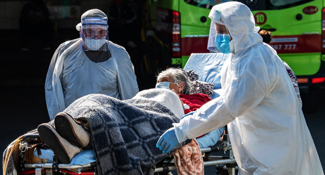 An elderly lady who had been affected by the new COVID-19 coronavirus is discharged from hospital, in Santiago, on May 18, 2020. Martin BERNETTI / AFP