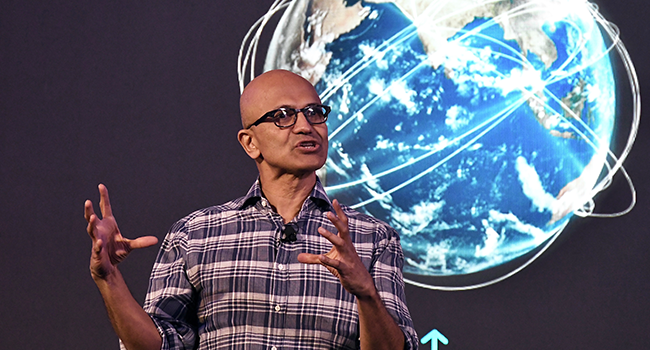 In this file photo taken on February 25, 2020 Microsoft Corporation Chief Executive Officer, Satya Nadella, gestures as he addresses the Future Decoded Tech Summit in Bangalore. Manjunath Kiran / AFP