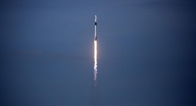 The SpaceX Falcon 9 rocket launches into space with NASA astronauts Bob Behnken (R) and Doug Hurley aboard the rocket from the Kennedy Space Center on May 30, 2020 in Cape Canaveral, Florida. Saul Martinez/Getty Images/AFP