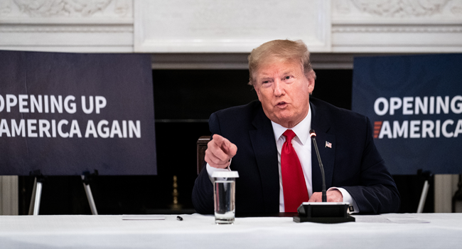 U.S. President Donald Trump speaks during a meeting with industry executives on the reopening of the U.S. economy in the State Dining Room May 29, 2020 in Washington, DC.  Erin Schaff-Pool/Getty Images/AFP