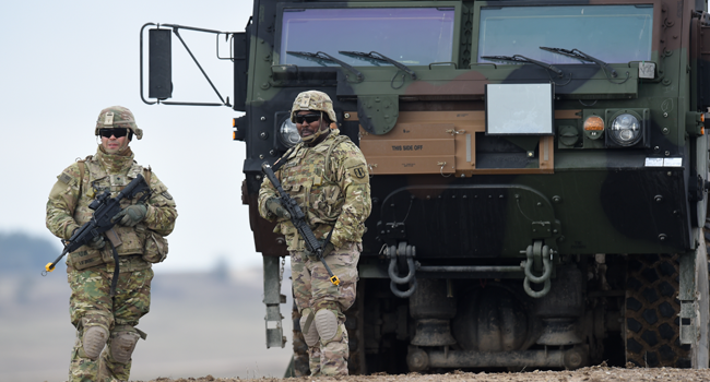 In this file photo taken on March 04, 2020, US soldiers patrol prior to an artillery live fire event by the US Army Europe's 41st Field Artillery Brigade at the military training area in Grafenwoehr, Germany. Christof STACHE / AFP
