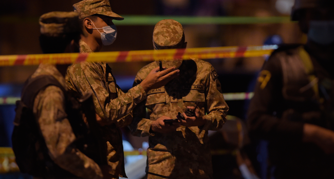 akistani army soldiers and policemen gather at a bomb explosion site, which killed one person and injured ten, in Rawalpindi on June 12, 2020. Farooq NAEEM / AFP