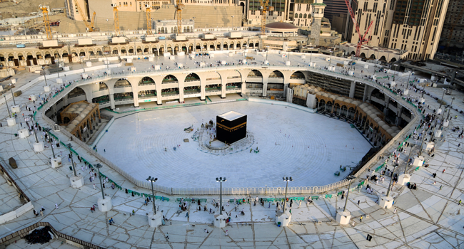 This file photo taken on March 05, 2020 shows the white-tiled area surrounding the Kaaba, inside Mecca's Grand Mosque, empty of worshippers. ABDEL GHANI BASHIR / AFP