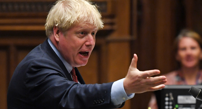 A handout photograph released by the UK Parliament shows Britain's Prime Minister Boris Johnson during Prime Minister's Questions (PMQs) in the House of Commons in London on July 15, 2020. JESSICA TAYLOR / AFP / UK PARLIAMENT