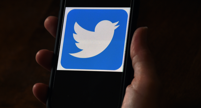 In this file photo illustration, a Twitter logo is displayed on a mobile phone on May 27, 2020, in Arlington, Virginia. Olivier DOULIERY / AFP