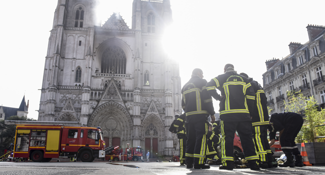 Firefighters are at work to put out a fire at the Saint-Pierre-et-Saint-Paul cathedral in Nantes, western France, on July 18, 2020. Sebastien SALOM-GOMIS / AFP