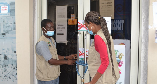 A photo released by the Lagos State Ministry of Health on July 11, 2020, showing officials locking up an illegal COVID-19 lab in the Banana Island area of the state.