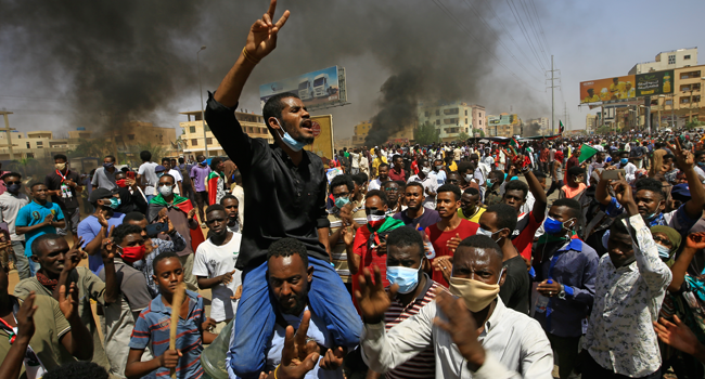 Sudanese demonstrators gesture as they chant during a protest on Sixty street in the east of the capital Khartoum, on June 30, 2020. ASHRAF SHAZLY / AFP