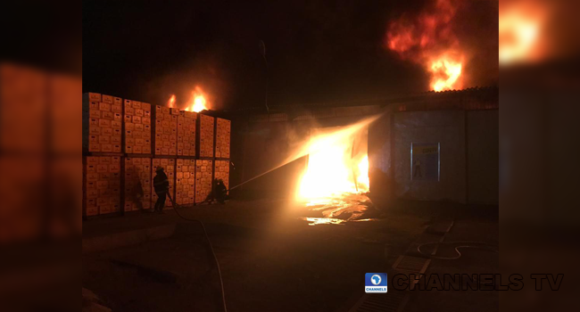 Firefighters work to quench an inferno at Ogba, Lagos on August 13, 2020.