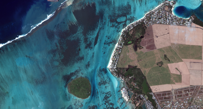 This August 12, 2020, handout satellite image obtained courtesy of Maxar Technologies shows an overview of the MV Wahashio shipwreck off the coast of Mauritius. Handout / Satellite image ©2020 Maxar Technologies / AFP