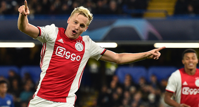 In this file photo taken on November 5, 2019 Ajax's Dutch midfielder Donny Van de Beek celebrates after scoring their fourth goal during the UEFA Champion's League Group H football match between Chelsea and Ajax at Stamford Bridge in London. GLYN KIRK / AFP