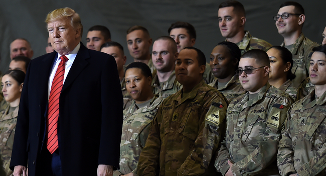 In this file photo US President Donald Trump speaks to the troops during a surprise Thanksgiving day visit at Bagram Air Field, on November 28, 2019 in Afghanistan. Olivier Douliery / AFP
