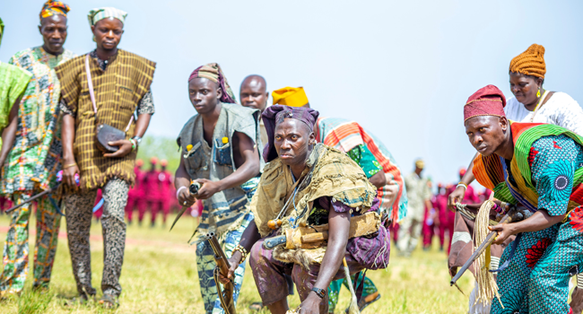 Men display guns at an Amotekun passing-out ceremony in Oyo State on November 18, 2020.