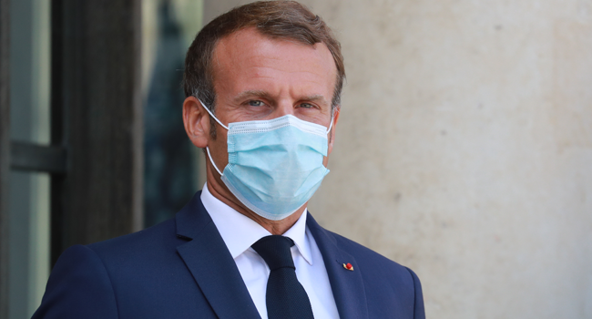 In this file photo taken on August 26, 2020 French President Emmanuel Macron, wearing a face mask, looks on as he waits for Senegal's President to arrive for their meeting at the Elysee Palace in Paris. Ludovic Marin / AFP