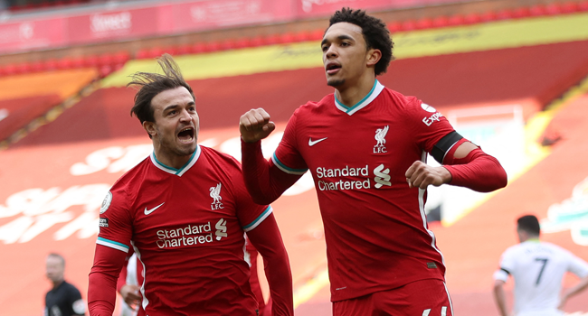 Liverpool's English defender Trent Alexander-Arnold (R) celebrates scoring his team's second goal during the English Premier League football match between Liverpool and Aston Villa at Anfield in Liverpool, north west England on April 10, 2021. Clive Brunskill / POOL / AFP