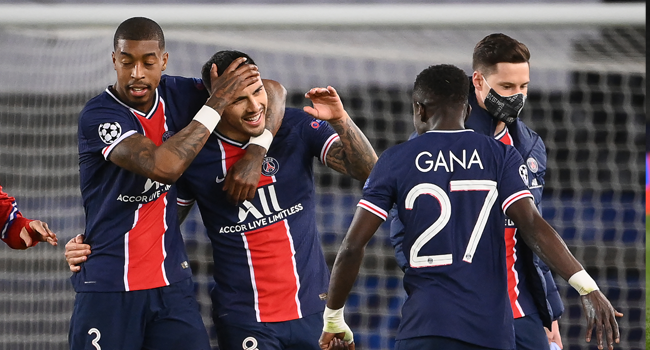 (From L) Paris Saint-Germain's French defender Presnel Kimpembe, Paris Saint-Germain's Argentinian midfielder Leandro Paredes, Paris Saint-Germain's Senegalese midfielder Idrissa Gueye and Paris Saint-Germain's German midfielder Julian Draxler celebrate after winning the UEFA Champions League quarter-final second leg football match between Paris Saint-Germain (PSG) and FC Bayern Munich at the Parc des Princes stadium in Paris, on April 13, 2021. FRANCK FIFE / AFP