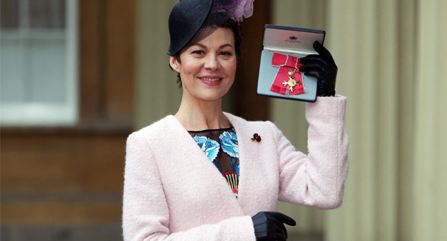 In this file photo taken on November 07, 2017 English actress, Helen McCrory poses after she was awarded an Officer of the Most Excellent Order of the British Empire (OBE) for services to drama, by Britain's Queen Elizabeth II during an investiture ceremony at Buckingham Palace in central London. Steve Parsons / POOL / AFP