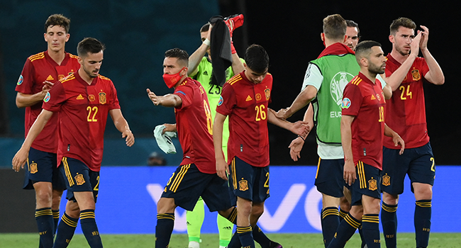 Spain's players react at the end of the UEFA EURO 2020 Group E football match between Spain and Poland at La Cartuja Stadium in Seville, Spain, on June 19, 2021. LLUIS GENE / POOL / AFP
