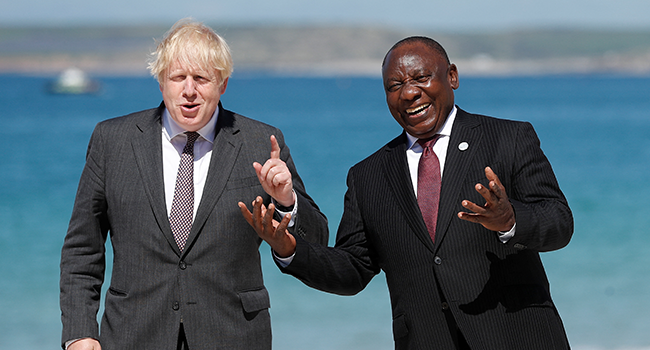 Britain's Prime Minister Boris Johnson (L) welcomes South Africa's President Cyril Ramaphosa at the G7 summit in Carbis Bay, Cornwall on June 12, 2021. PETER NICHOLLS / POOL / AFP