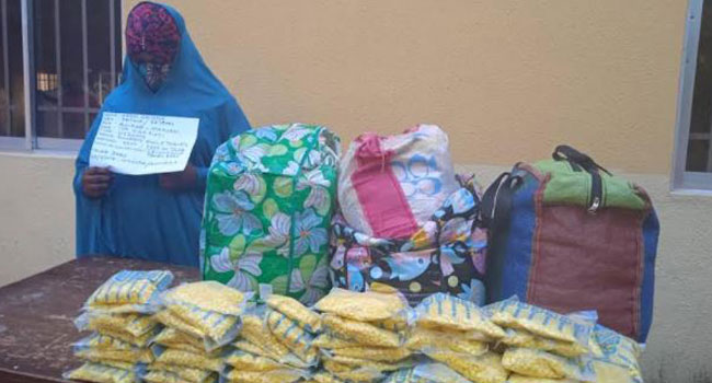 Chioma in hijab with exhibits.