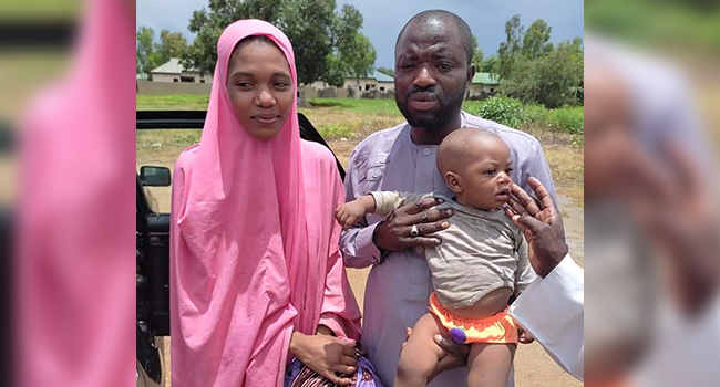 A former councilor of Tundunwada ward of Gusau local government of Zamfara State, Babangida Haruna, stands with his wife after they regained freedom from kidnappers on August 13, 2021.