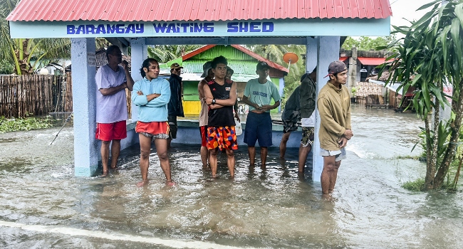 Stranded people wait out Typhoon Rai pummeling Philippines